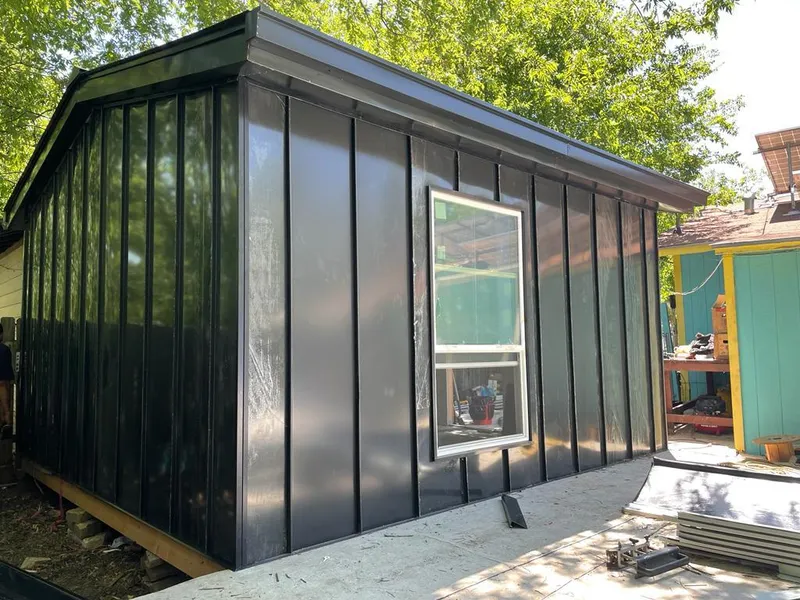 Black standing seam metal wall panels for Metal Roof Installation in Oshtemo