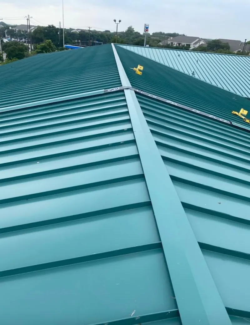 Green commercial metal roof ridge and valley for Metal Roof Repair in Oshtemo